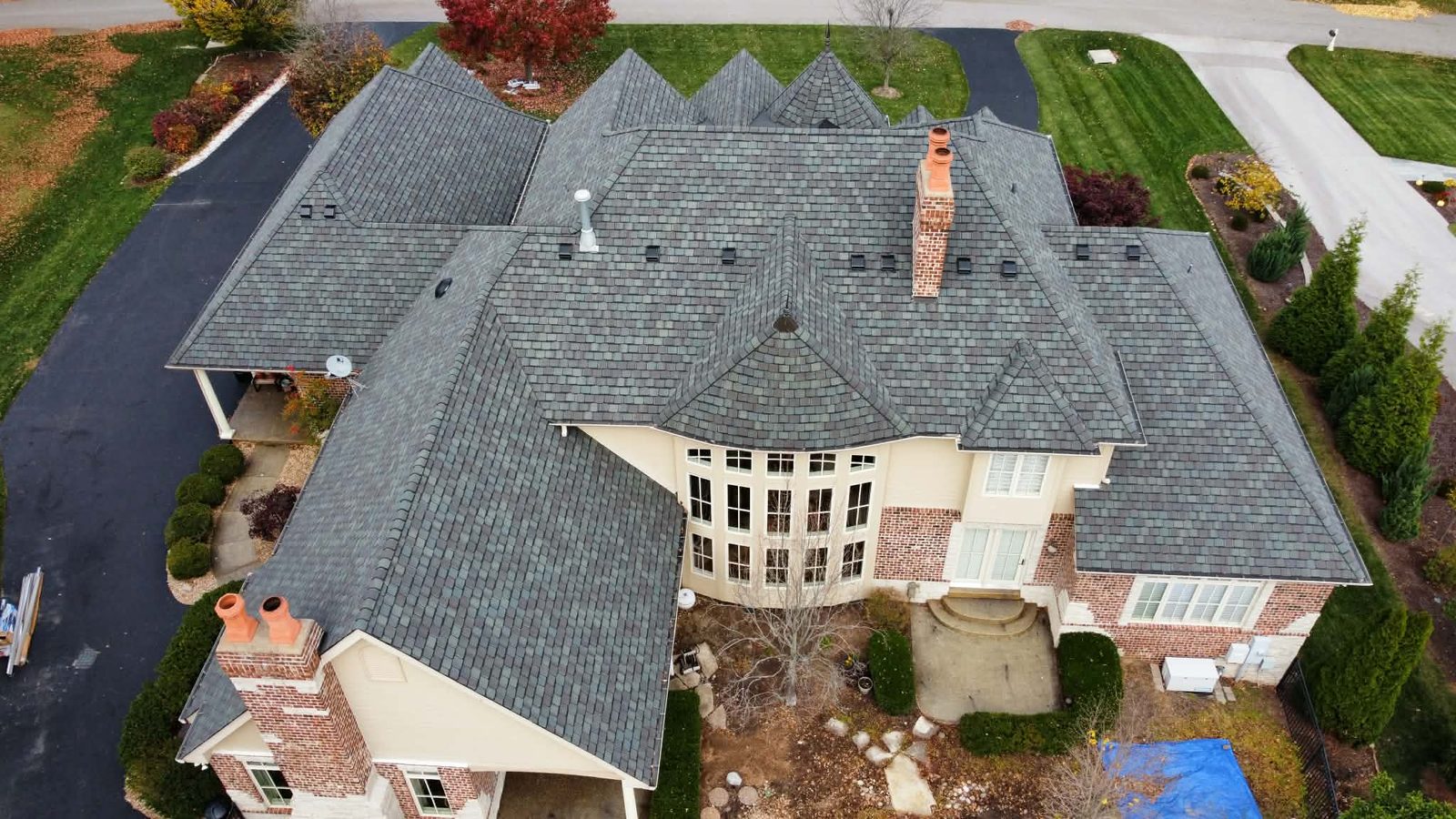 Aerial view of a completed estate roof replacement by ArchTop Roofing