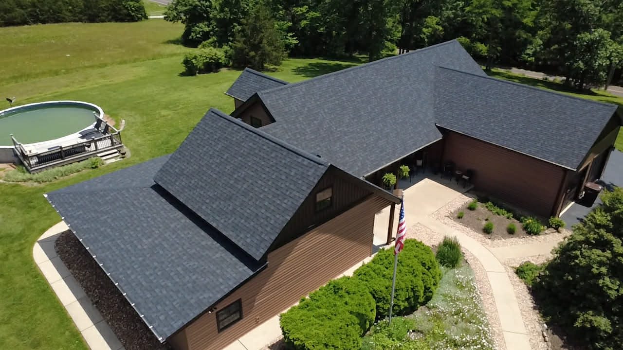 Angled aerial of a completed architectural shingle roof