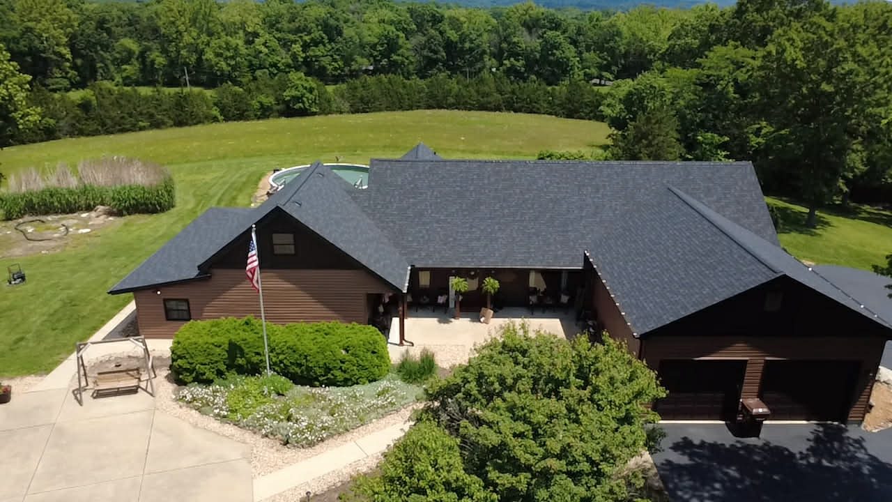 Ranch home with a completed architectural shingle roof
